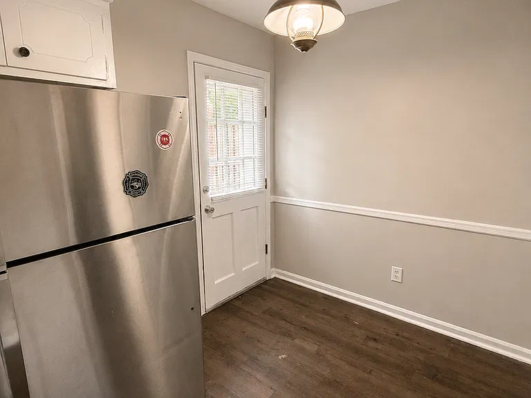 Dining area beside the kitchen and rear door