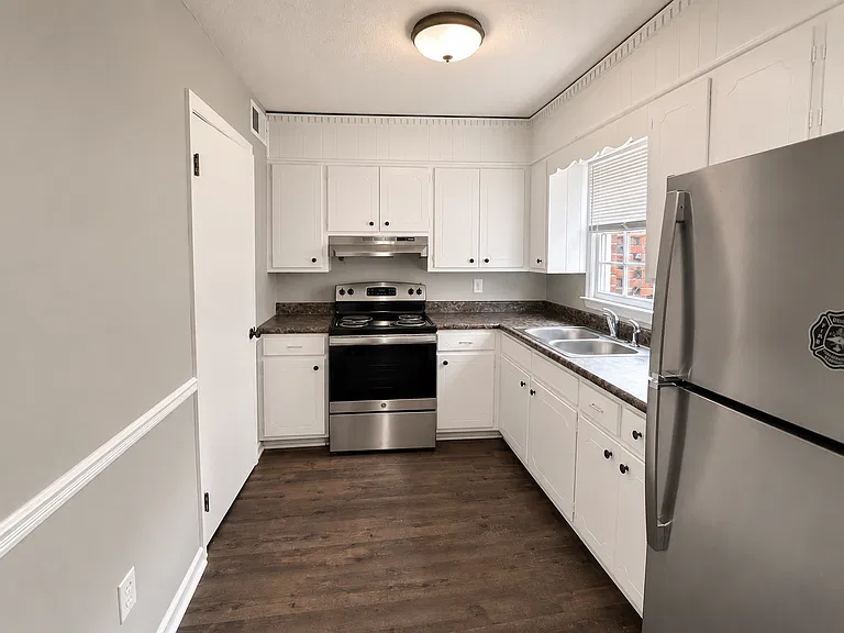 Kitchen with white cabinets and stainless steel appliances